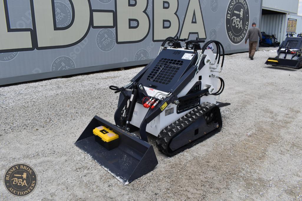 Mini excavator with tracked movement and hydraulic arm. Ideal for small construction and landscaping.
