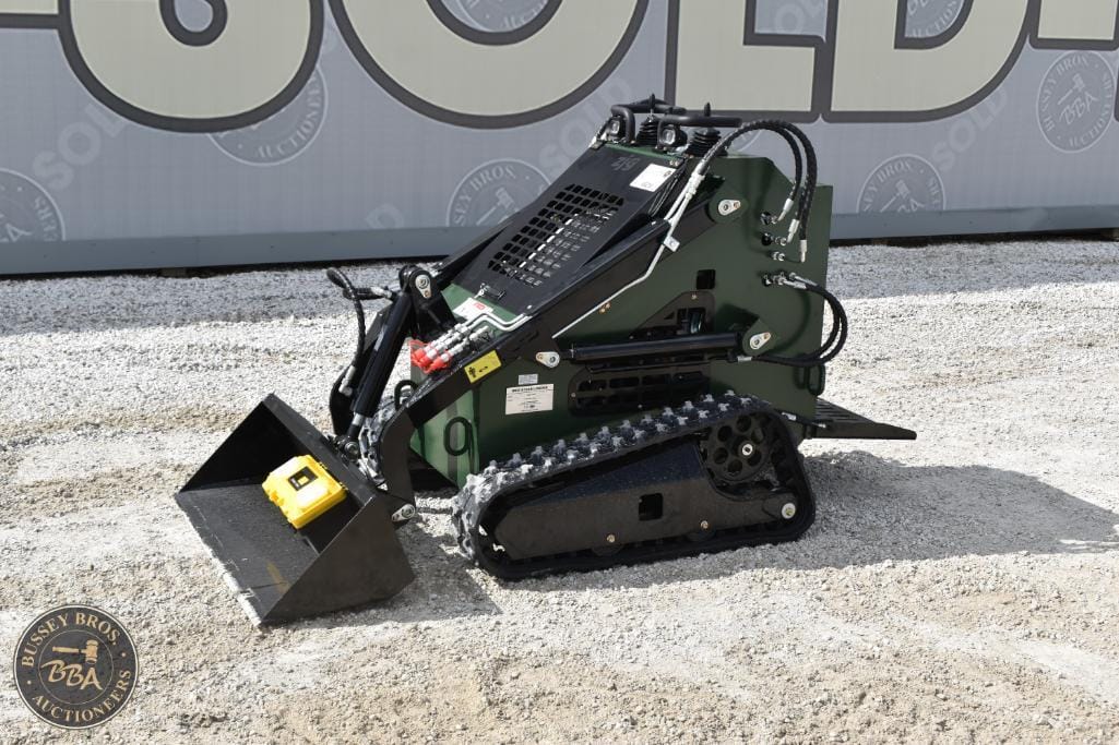 Compact mini excavator with rubber tracks for construction and landscaping projects.