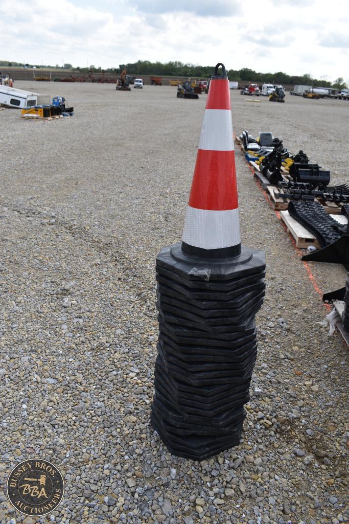 Traffic cone on rubber base for safety at outdoor auction events.