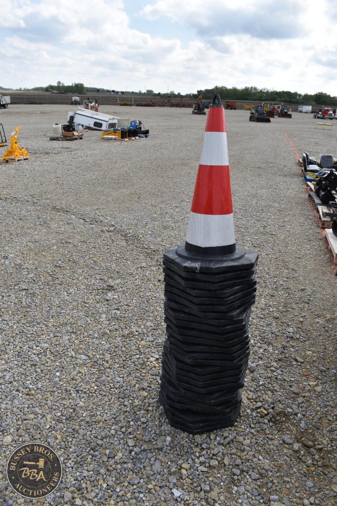 Traffic cone with black base at Bussey Bros Auctioneers outdoor lot.