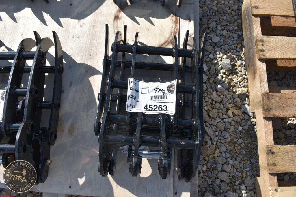 Excavator bucket attachments displayed for auction at Bussey Bros, ideal for construction and demoli.