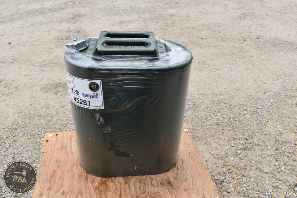 Fuel canister with a handle, black color, and a spout, displayed on a wooden surface.