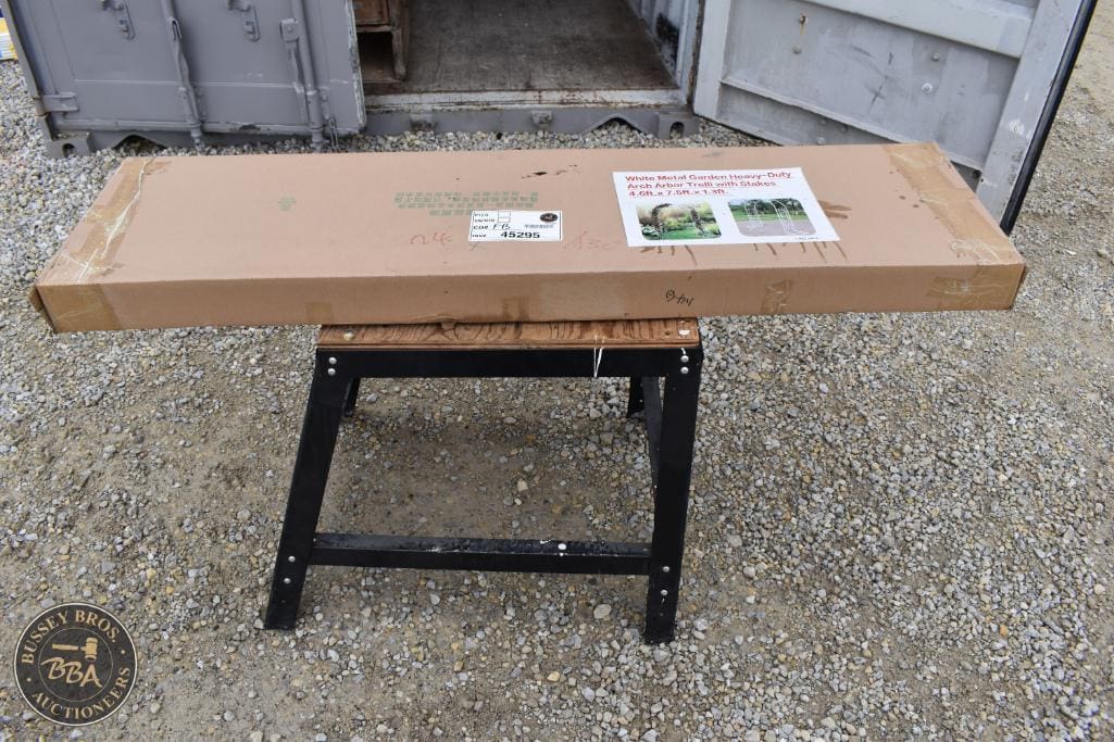 Wooden garden bench in packaging for auction at Bussey Bros Auctioneers.
