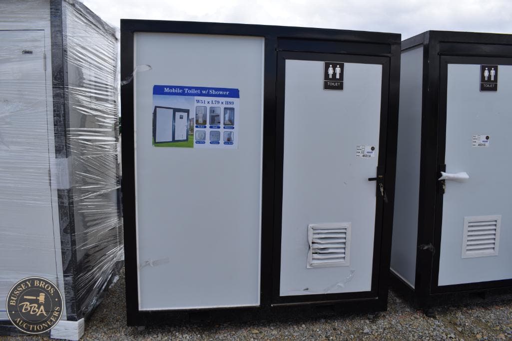 Mobile toilet with shower unit for events, construction, and outdoor use by Bussey Bros Auctioneers.