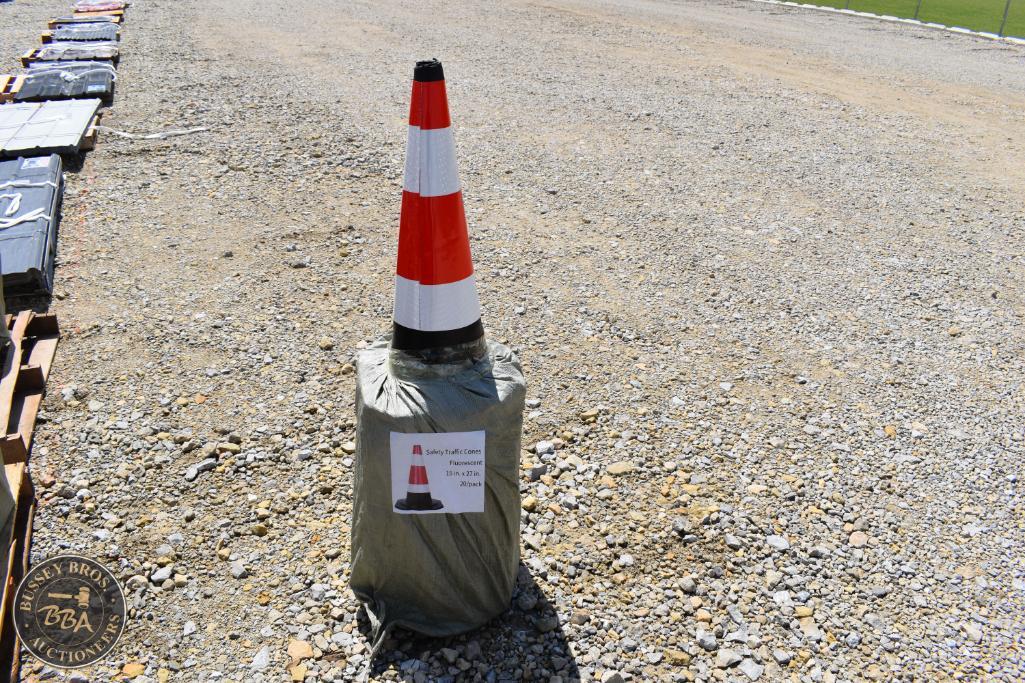 Traffic cone with base weight for safety at outdoor auction events.