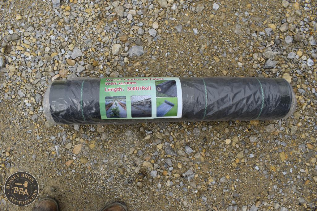 Black weed control fabric roll for gardening, landscaping, or ground cover.