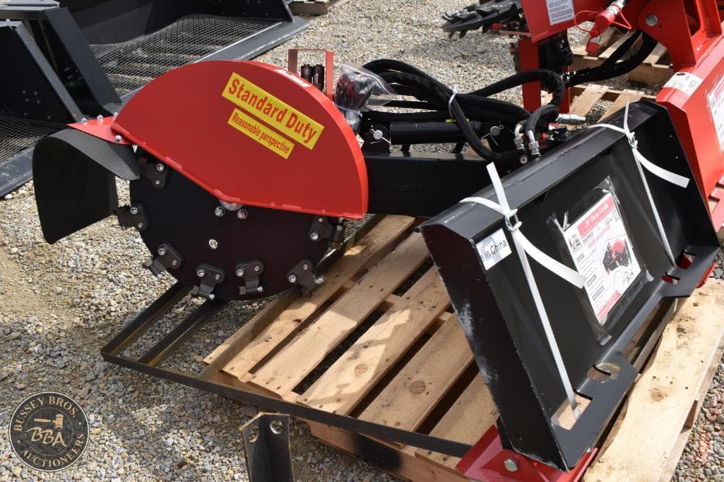 Heavy-duty tree cutter attachment for forestry equipment, ideal for land clearing and tree removal.