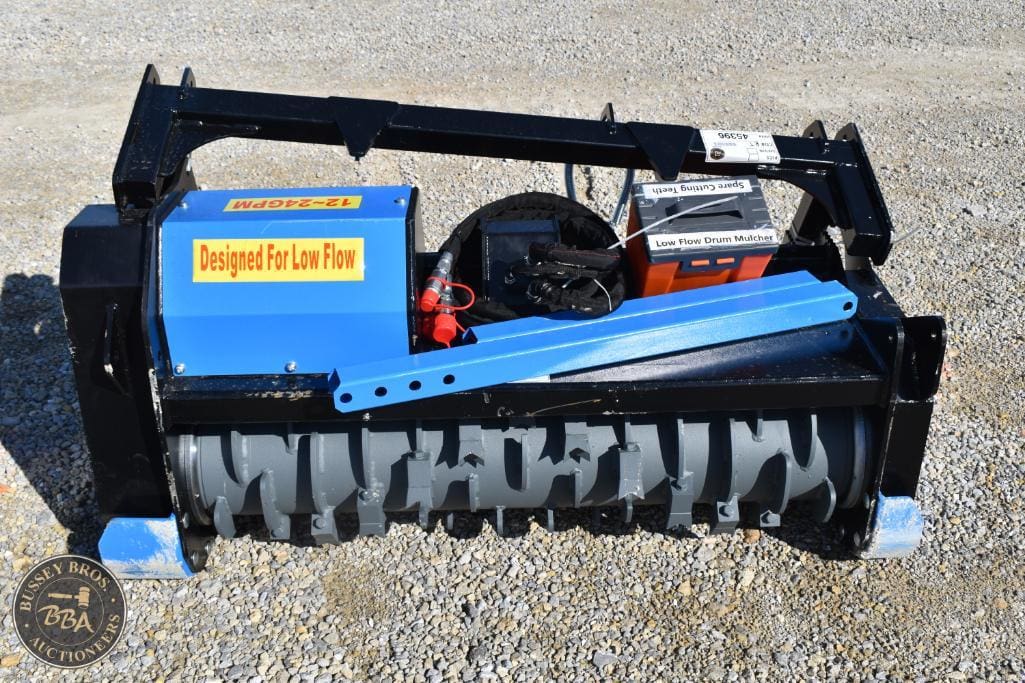 Industrial soil tiller attachment for landscaping and agricultural use.