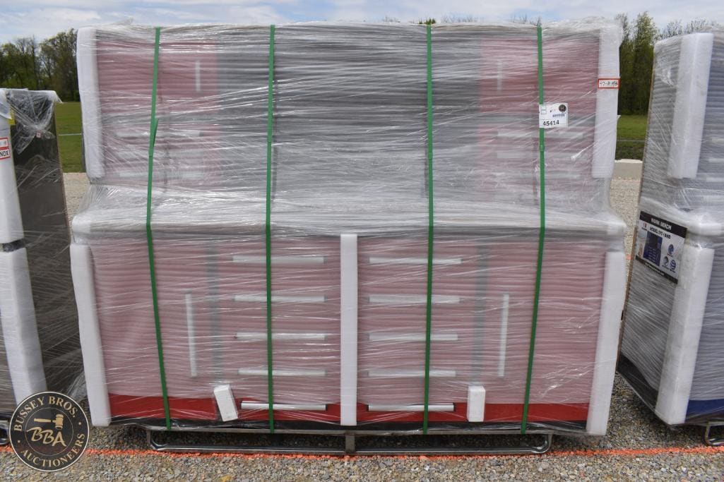 Pallet of construction materials wrapped in plastic, ready for auction at Bussey Bros Auctioneers.