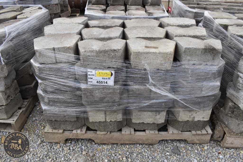 High-quality stone paving slabs stacked on pallets, ready for sale at auction. Ideal for landscaping.