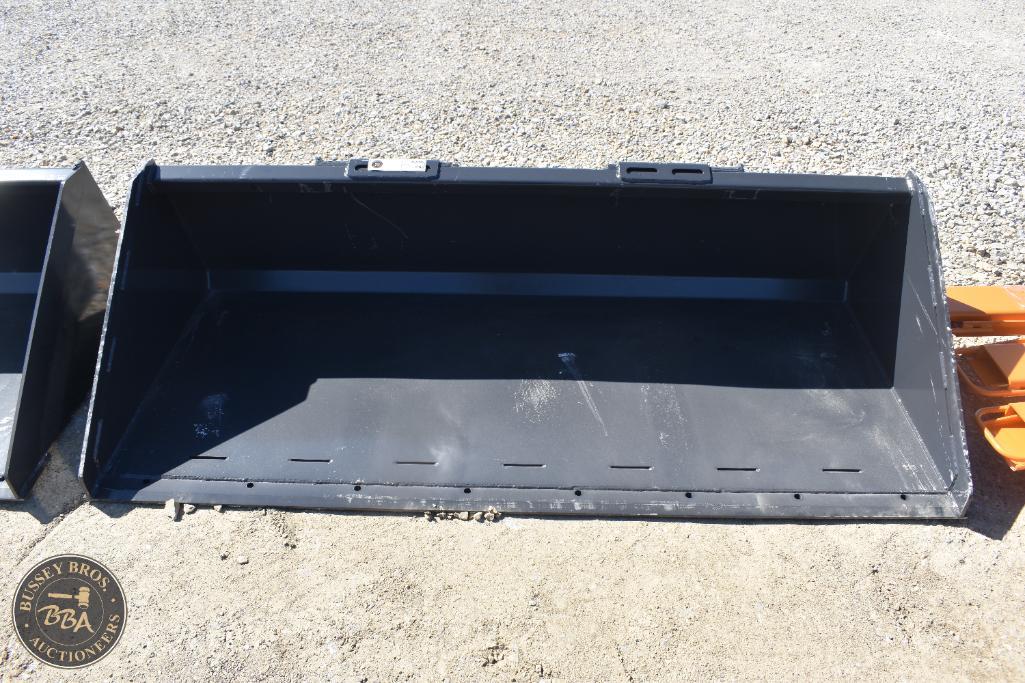 Heavy-duty black construction equipment bucket for sale at Bussey Bros Auctioneers.