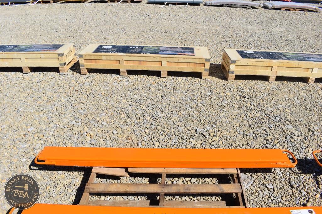 Heavy-duty orange lifting equipment on gravel at Bussey Bros Auctioneers.