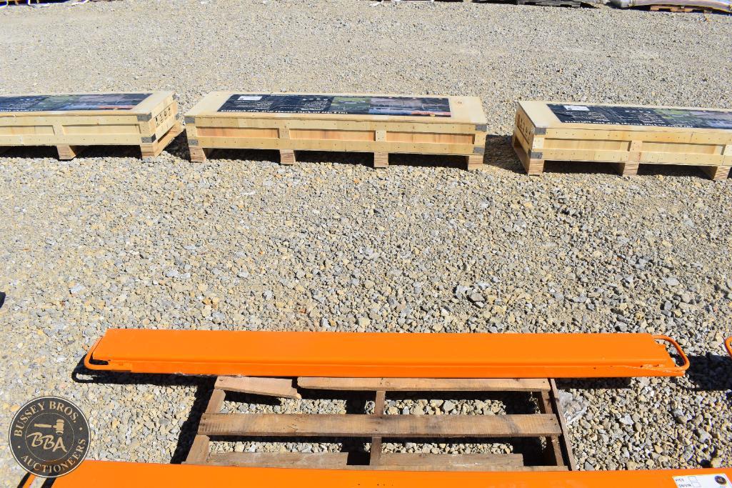 Outdoor equipment and tools at Bussey Bros Auctioneers, including a bright orange safety barrier and.