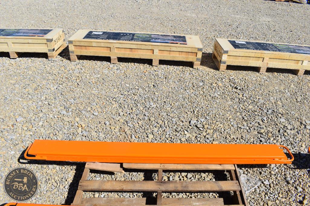 Heavy-duty orange lifting beam for industrial use at Bussey Bros Auctioneers.