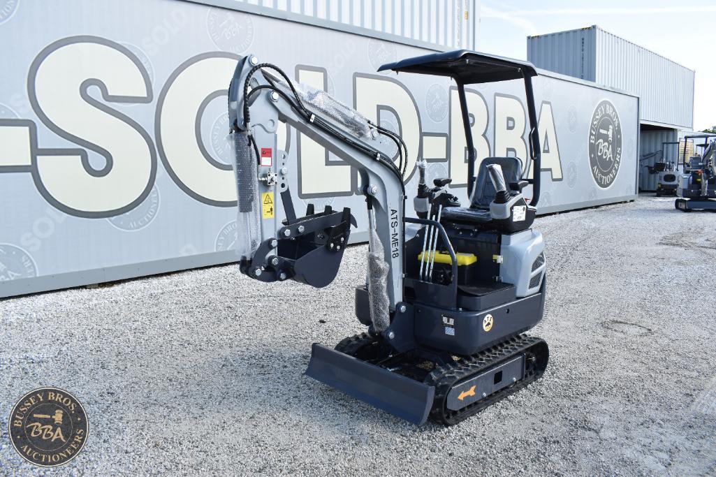 Compact mini excavator available for auction at Bussey Bros, ideal for construction and landscaping.