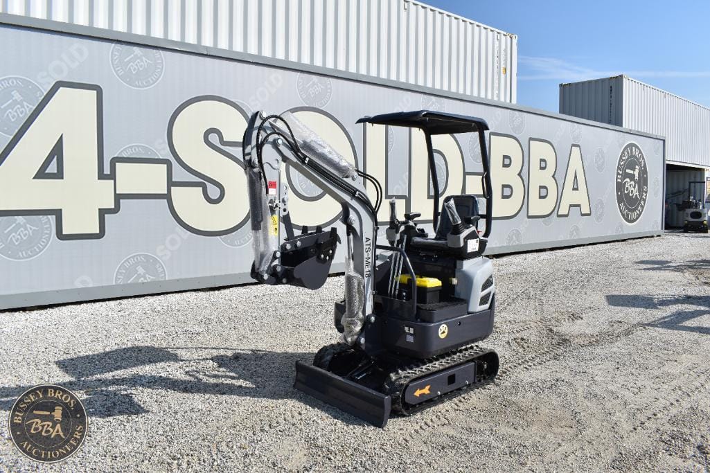 Mini excavator with compact design and tracked movement, ideal for construction and landscaping proj.