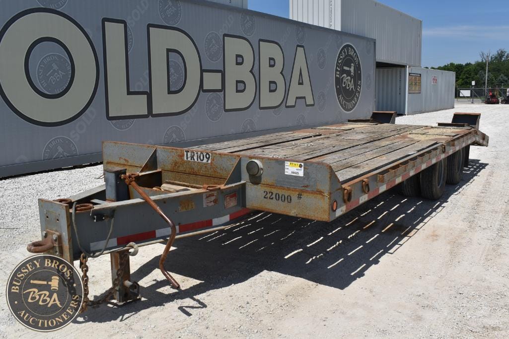 Heavy-duty flatbed trailer for sale at Bussey Bros Auctioneers.