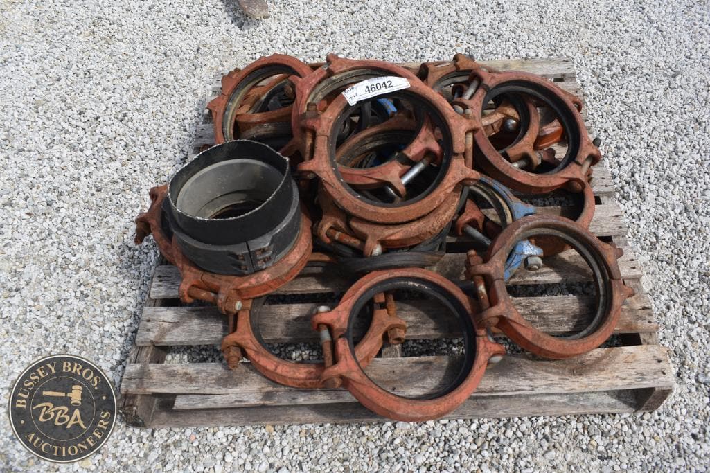 Industrial metal clamps and fittings for auction.