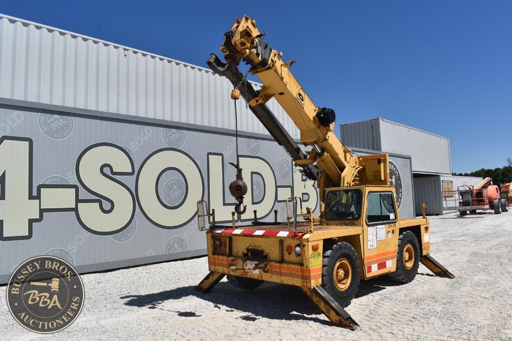 Mobile crane lifting equipment at Bussey Bros Auctioneers.