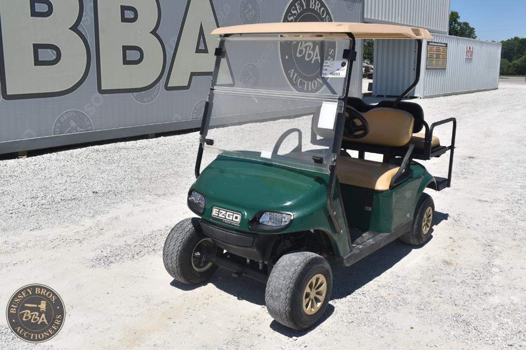 Golf cart with beige seats and green body, available at Bussey Bros Auctioneers. Perfect for golf co.