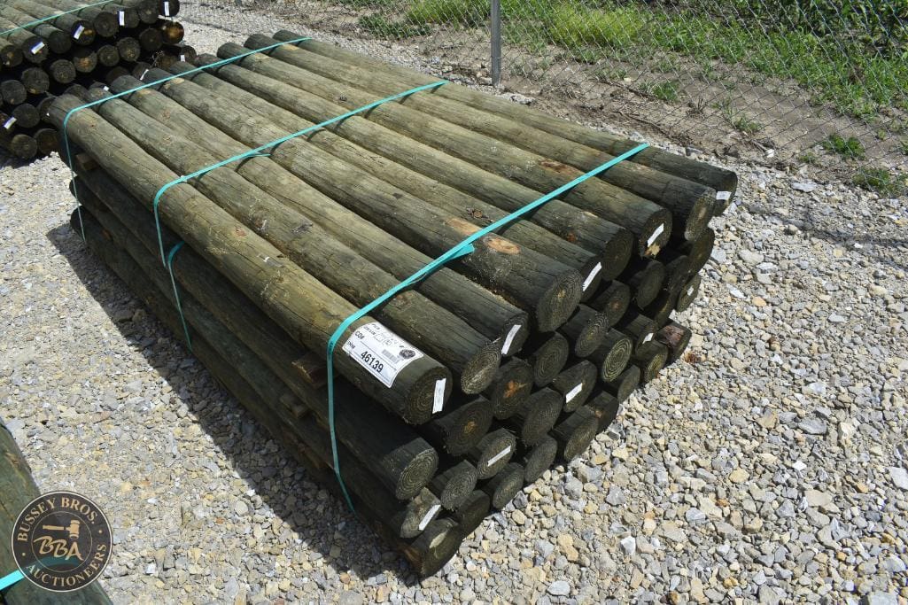 Bundle of wooden fence posts for sale at auction by Bussey Bros Auctioneers.