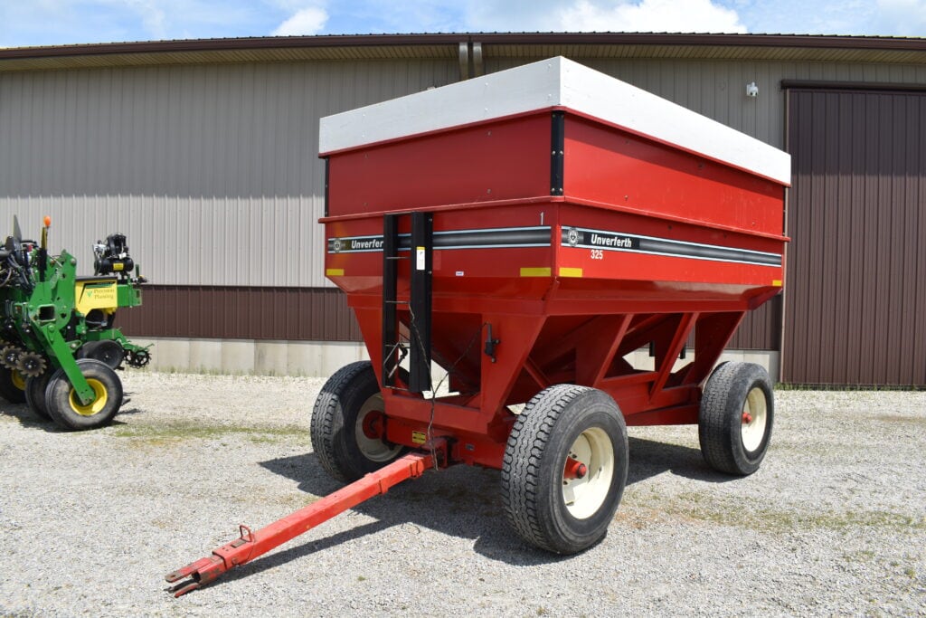 Red farm fertilizer spreader at Bussey Bros Auction.
