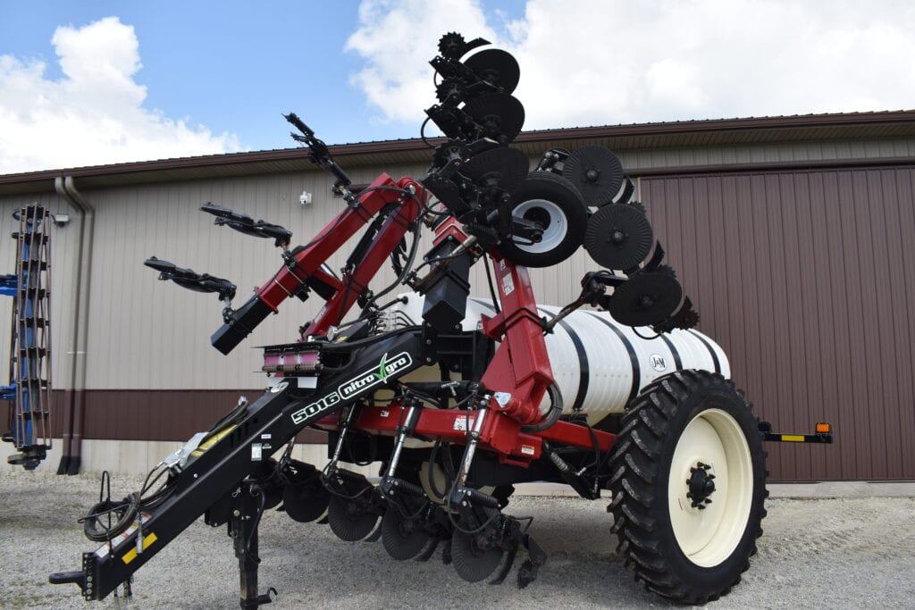 Large agricultural sprayer equipment at HANSBARGER FARM RETIREMENT AUCTION.