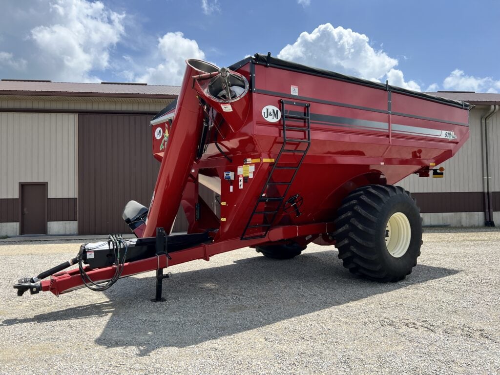 Red J&M grain cart for sale at Bussey Bros Auctioneers.