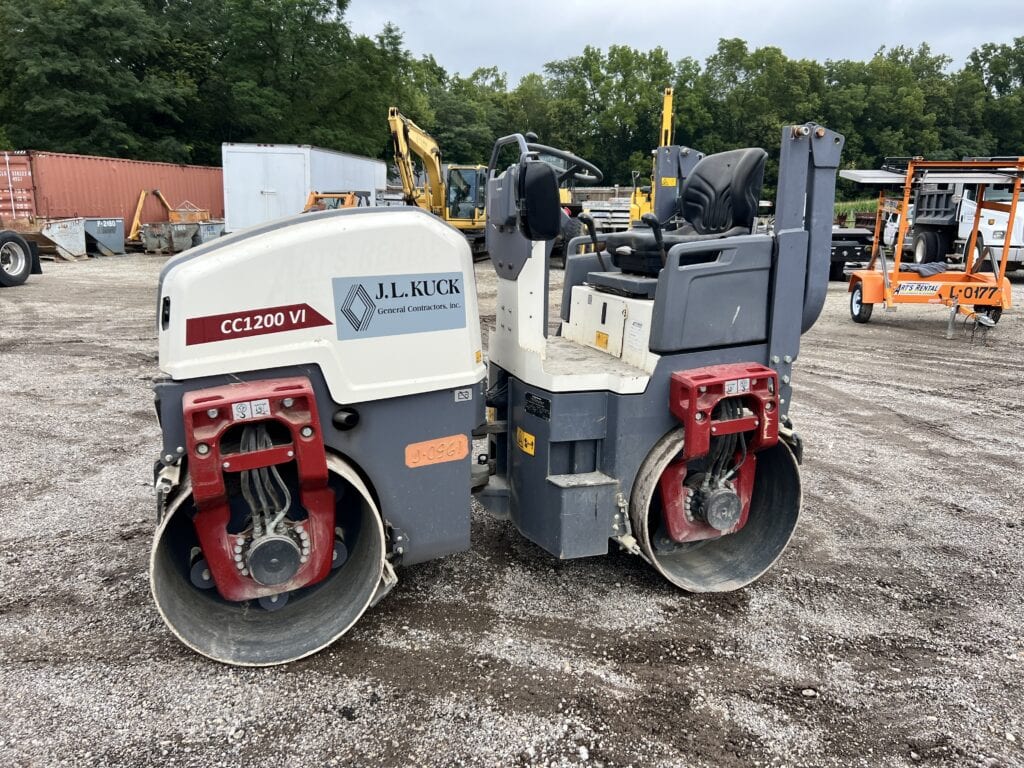 Compact road roller with J.L. Kuck branding for construction use.
