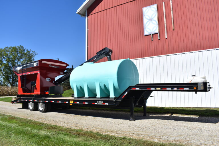 Large farm tank and equipment trailer at Stebbins Farm Retirement Auction.