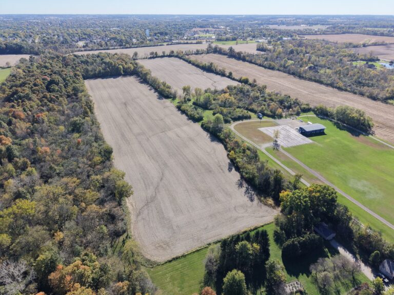 Aerial view of farmland and sports facilities near Stanforth Real Estate Auction.