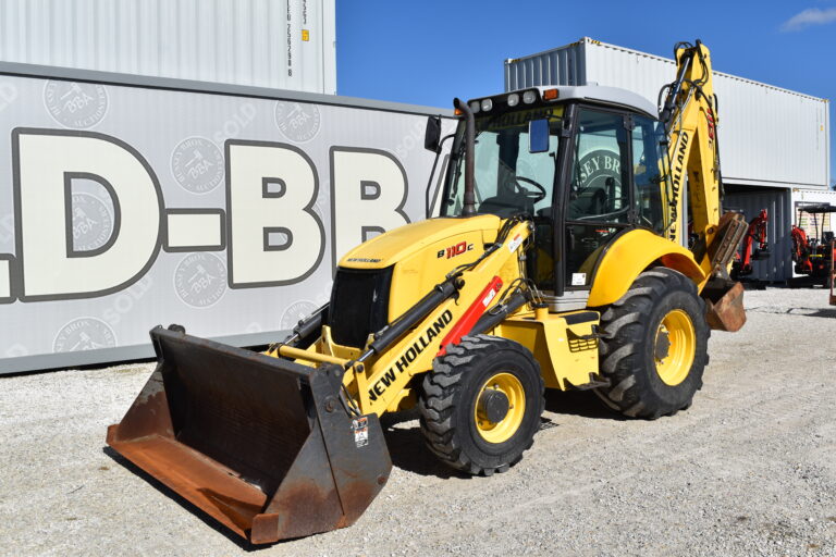 Yellow New Holland backhoe loader at Bussey Bros auction site.