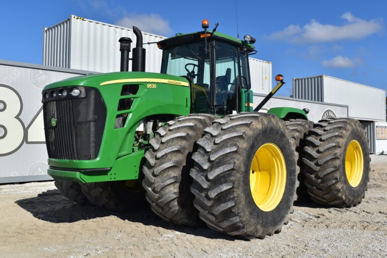 Green John Deere 9530 tractor at Bussey Bros Auctioneers.