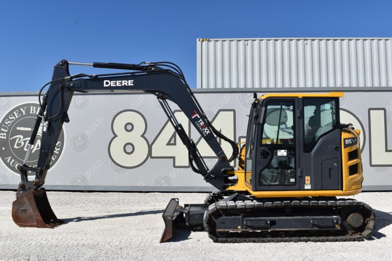 Yellow and black mini excavator at Bussey Bros Auctioneers.