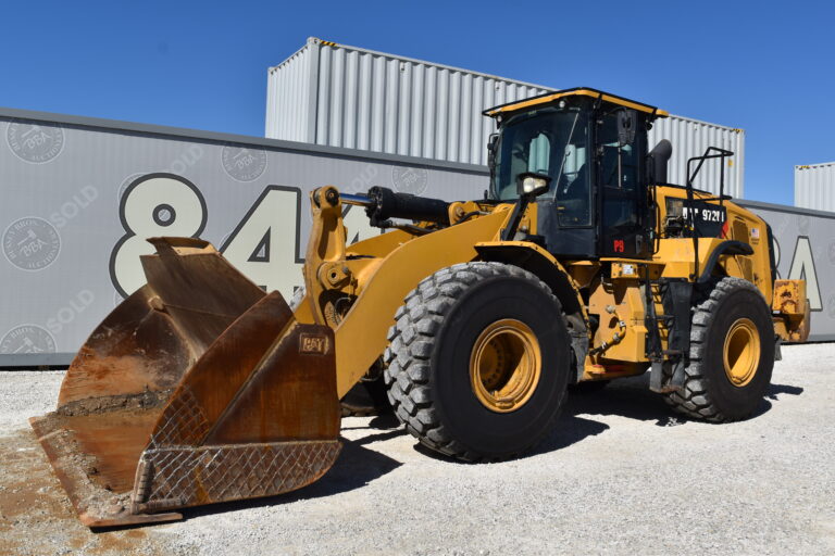 Large yellow front loader bulldozer at Bussey Bros Auctioneers.