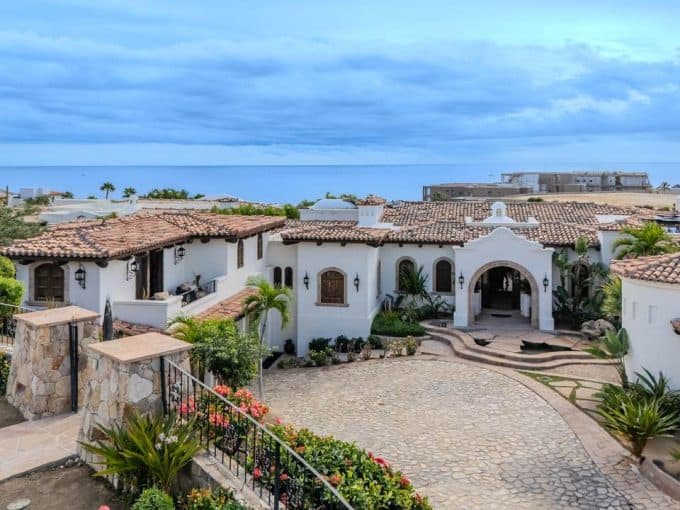 Aerial View Of A Spanish-Style Villa In Cabo Del Sol With The Ocean Beyond
