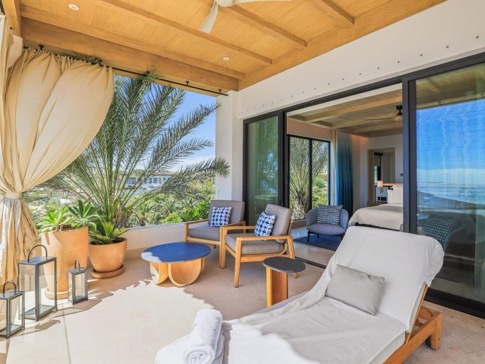 Cabo Del Sol Oceanfront Terrace With Lounge Chairs And Plants.