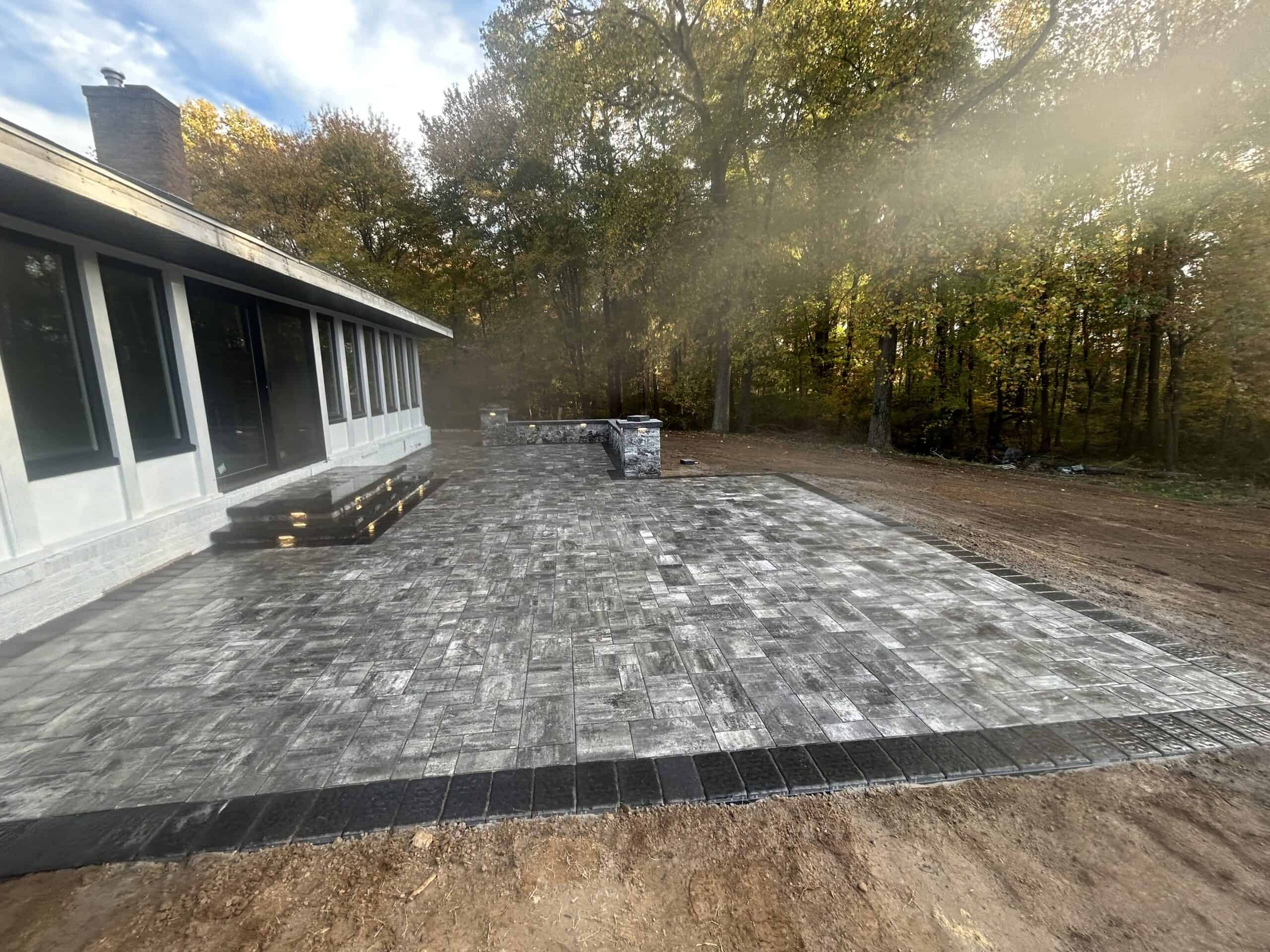 Professional patio installation with stamped concrete by C&J Outdoor Services.