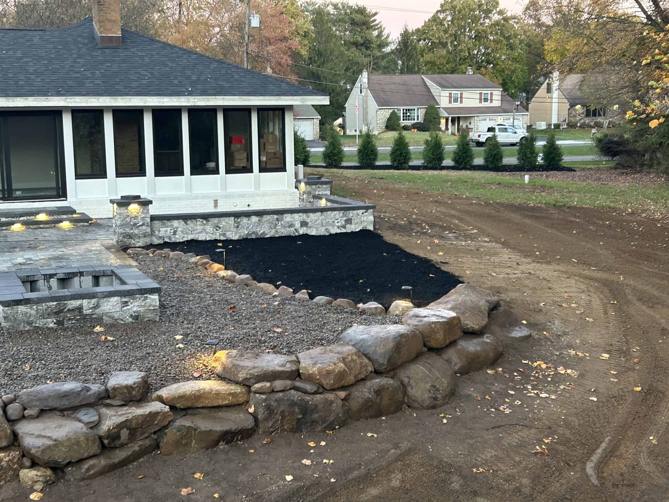 Professional landscaping and yard design by C&J Outdoor Services in a residential backyard.