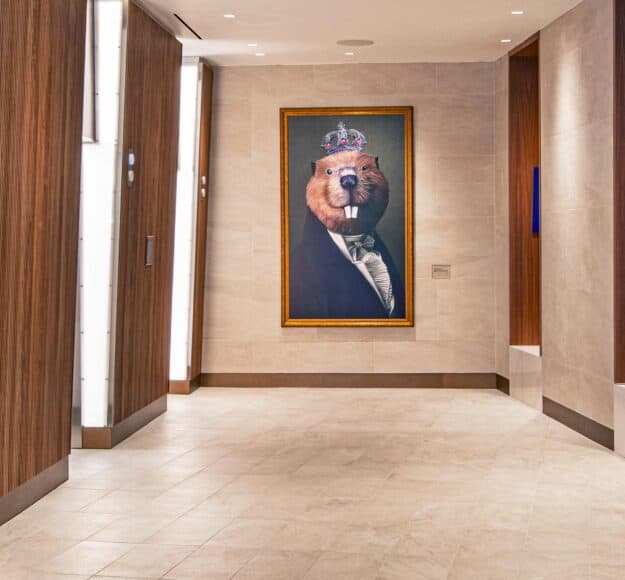 Image of The Royal Sonesta Capitol Hill lobby by the elevator, with a mascot.