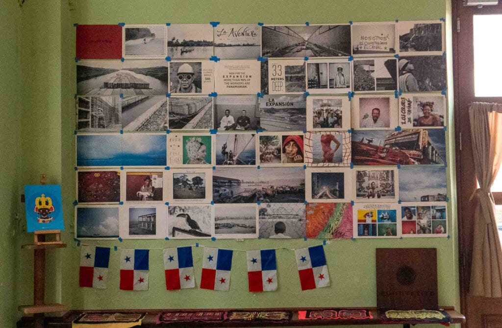 Wall of local artwork displayed at Super Gourmet in Casco Viejo, Panama — a tribute to community and creativity
