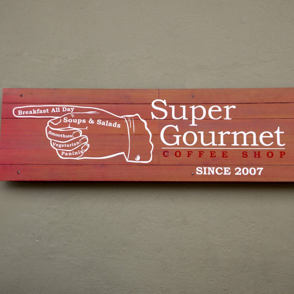 Super Gourmet Coffee Shop sign on A Avenue and 6th Street, Casco Viejo Panama, established 2007