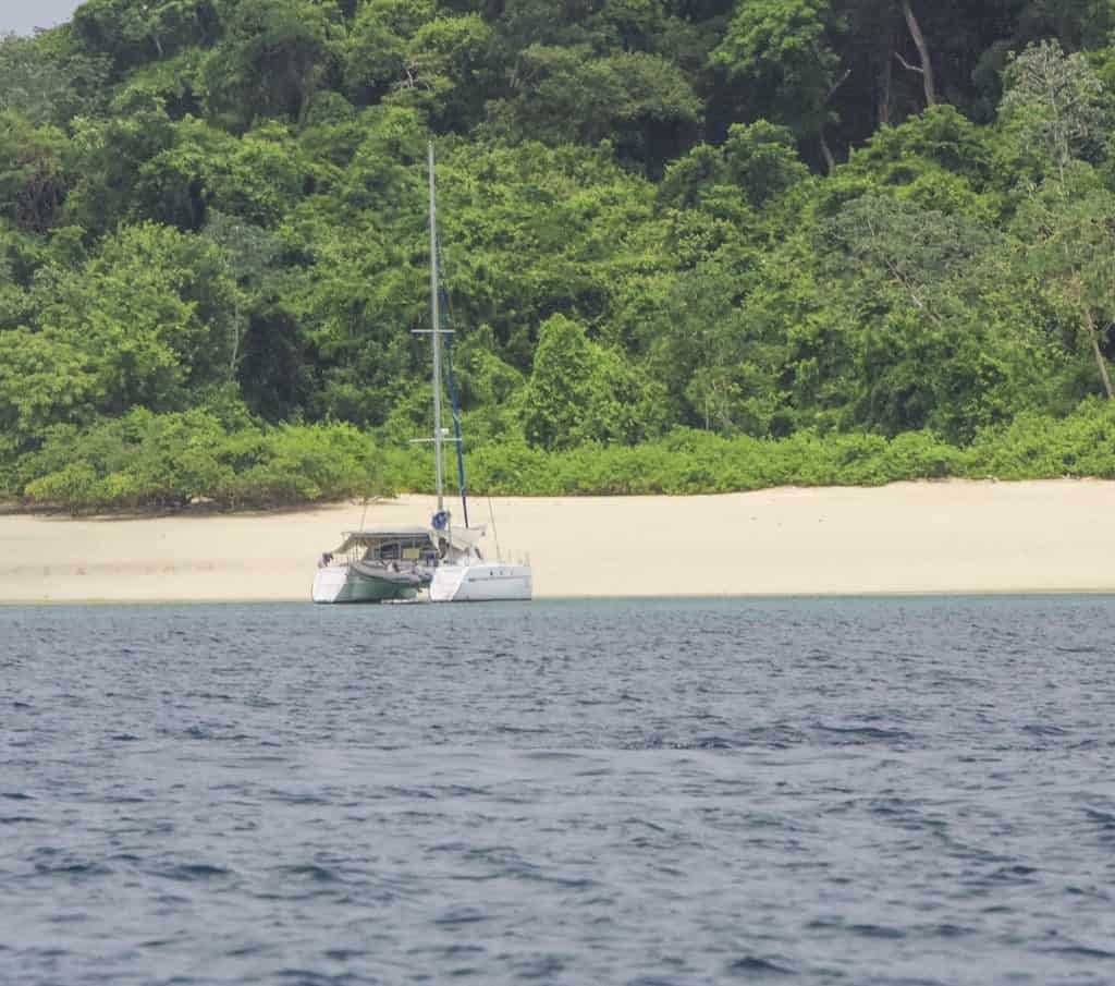 Catamaran anchored off a secluded beach on Contadora Island, Panama.