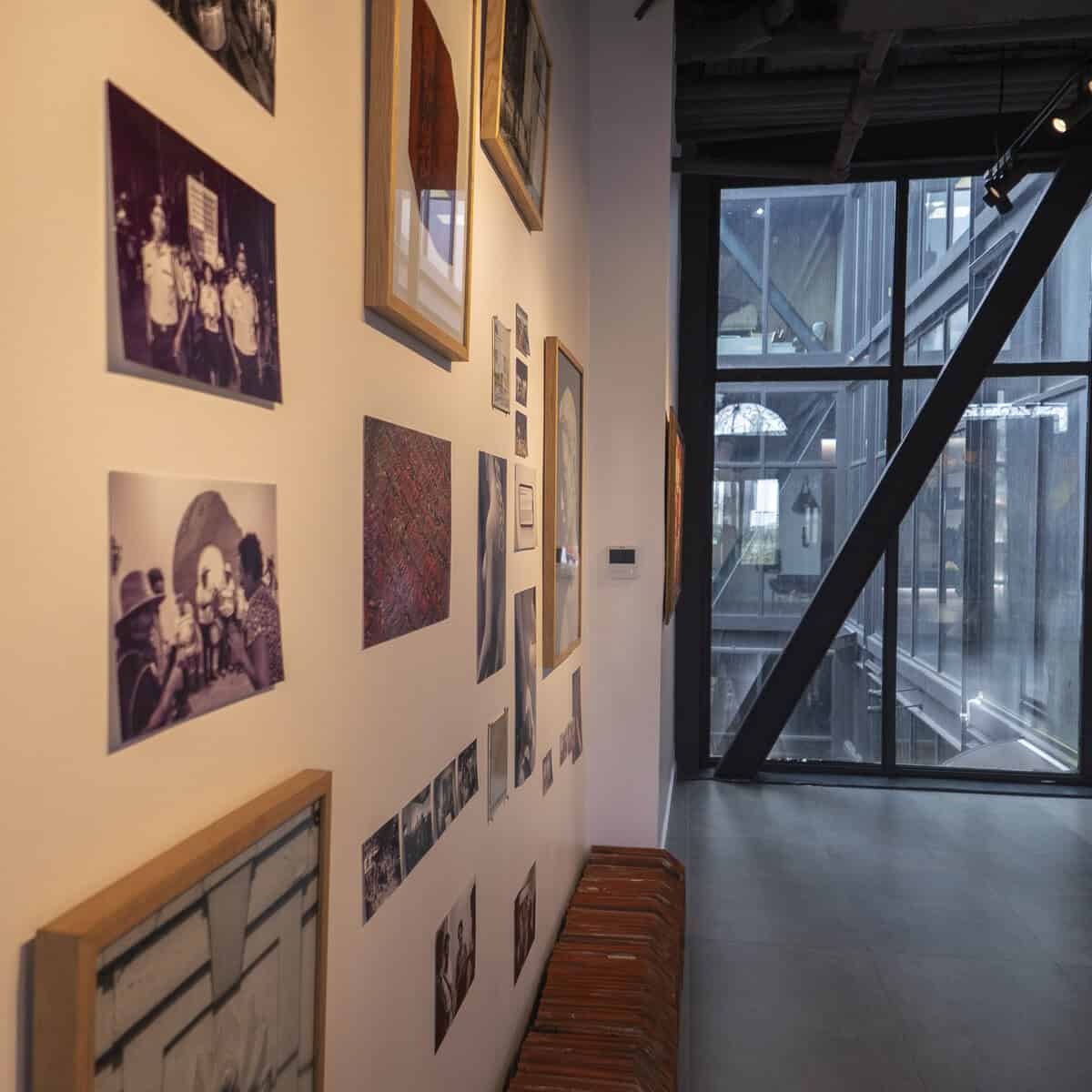 Historic photographs and artworks displayed on the wall at MAC Panamá Casco Antiguo exhibition space
