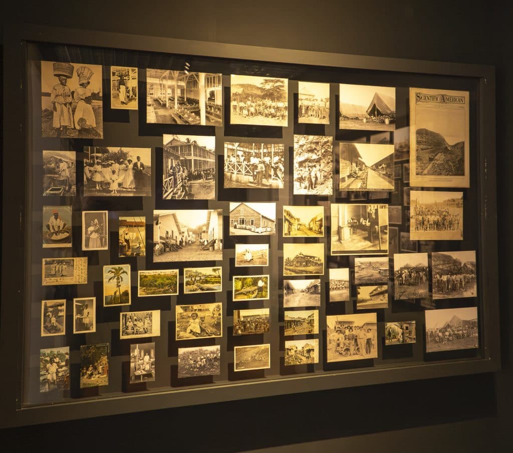 Archival photo collage showing workers, engineers, and daily life during the construction of the Panama Canal, displayed at the Panama Canal Museum in Casco Viejo.