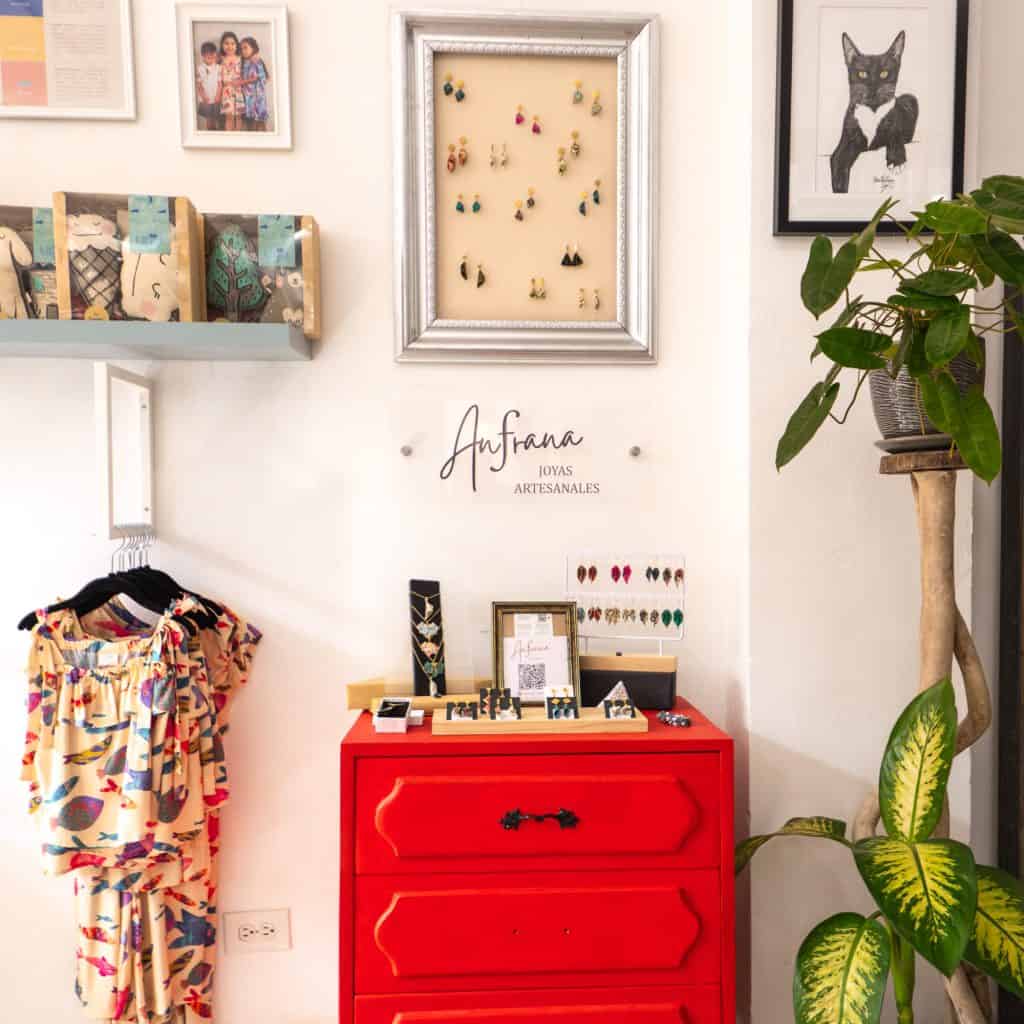 Handmade jewelry on red dresser at Afana Joyas Artesanales boutique in Casco Viejo, Panama