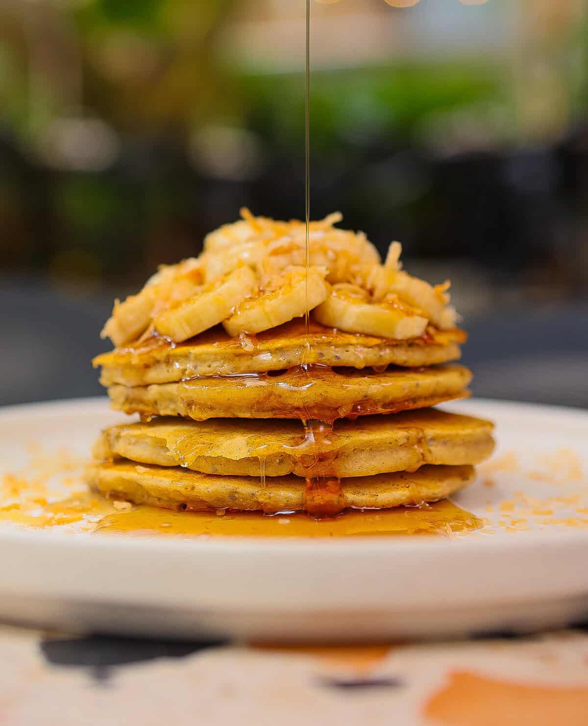 Stack of pancakes with caramelized bananas and syrup at Mahalo in Casco Viejo, Panama