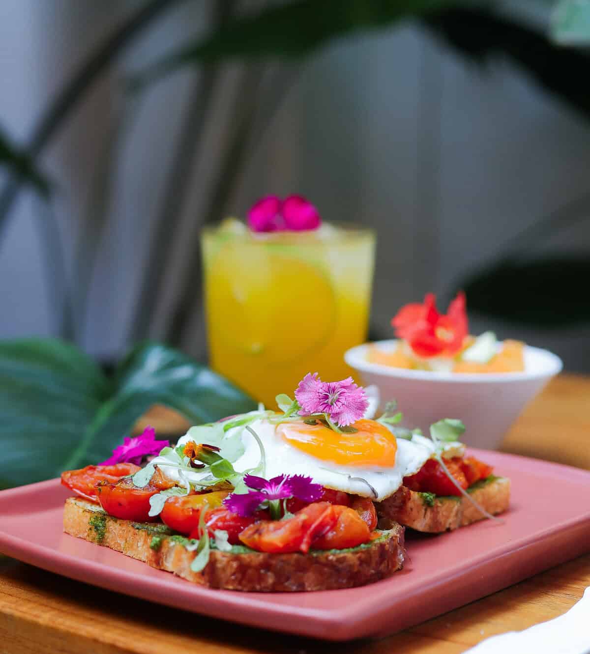 Avocado toast with poached eggs and fresh fruit at Snack Shack in Casco Viejo, Panama