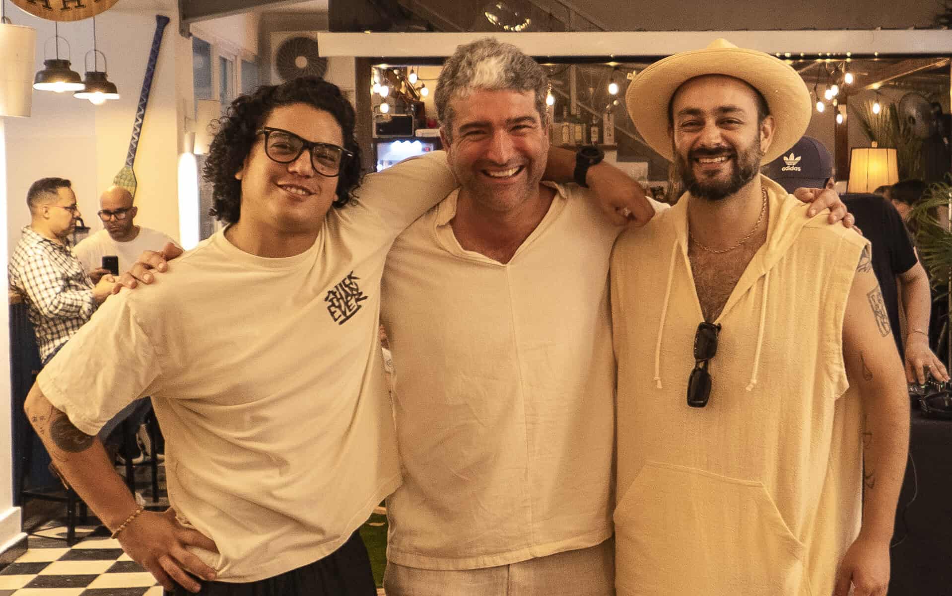 David, Teddy, and Danielle — founders of Galería Solar in Casco Viejo, Panama — standing in front of a colorful Guna mola backdrop.