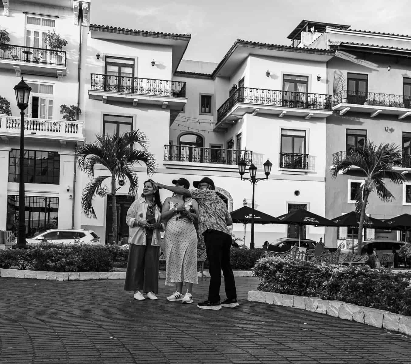 Local resident giving directions to visitors in a plaza in Casco Viejo Panama